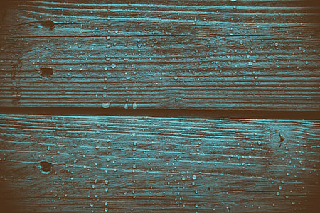 Closeup shot of coloured wood panels with fresh raindrops, image captured with a Canon DSLR thumbnail
