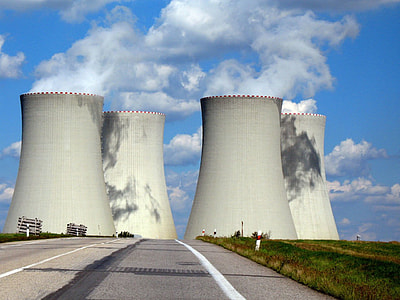four white silos during daytime thumbnail