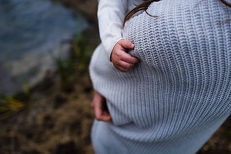 woman in white knitted long-sleeved shirt thumbnail