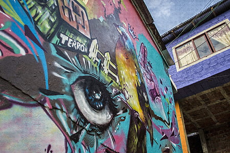 wall with teal and purple graffiti thumbnail