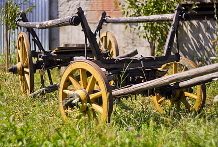 brown wooden trailer on grass during daytime thumbnail