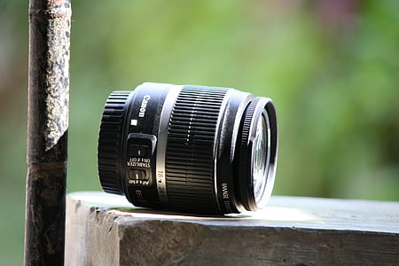Black Canon Lens on Gray Concrete Table thumbnail