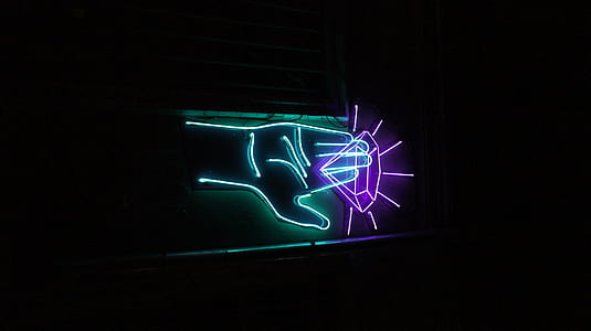 green hand holding purple diamond LED signage thumbnail
