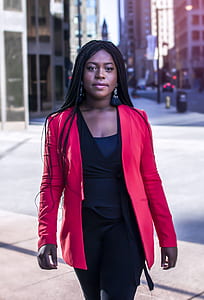 woman standing near high-rise buildings thumbnail