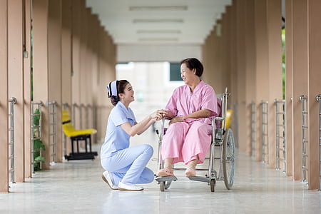 woman in pink dress sitting in wheel chair thumbnail