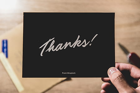 person holding thanks card thumbnail