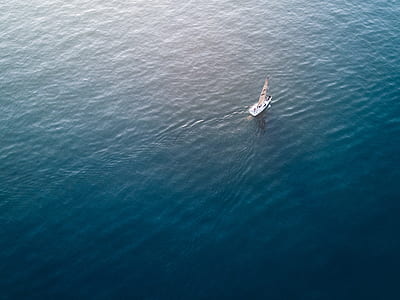 photo of sail boat on body of water thumbnail