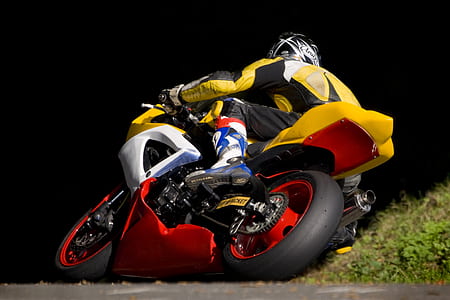motorcycle rider riding on sports bike on corner thumbnail