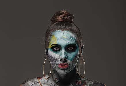 photo of woman newspaper face paint thumbnail
