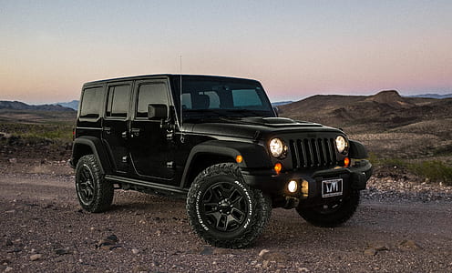 black Jeep Wrangler SUV thumbnail