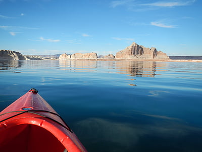 red kayak on body of water thumbnail
