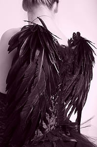 woman wearing black dress with wings thumbnail