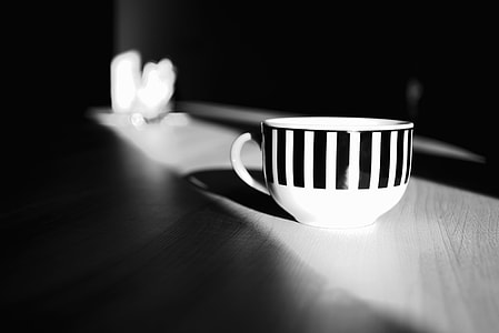 grayscale focus photography of mug thumbnail