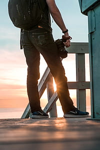 man holding DSLR camera thumbnail
