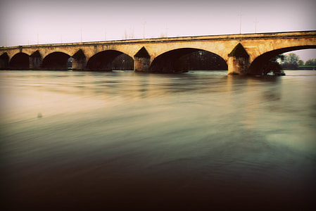 gray concrete bridge at daytime thumbnail
