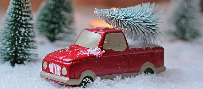 red pick-up truck on snow thumbnail