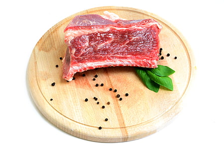 sliced meat on round brown chopping board thumbnail