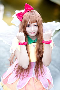 girl wearing yellow and pink dress with wings thumbnail