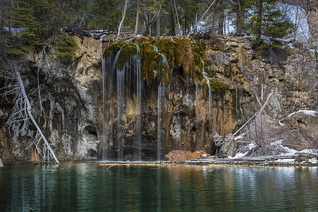 brown cliff and body of water thumbnail