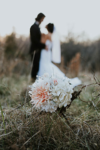 photo of white flower with newly wed background thumbnail