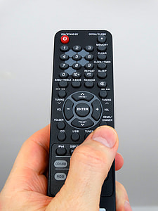 person holding remote control thumbnail
