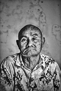 gray scale photo of man wearing collared button-up top thumbnail