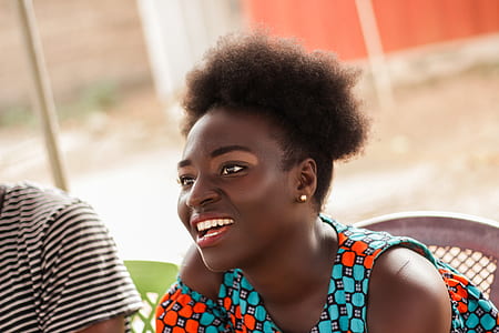 woman sitting on chair beside person thumbnail