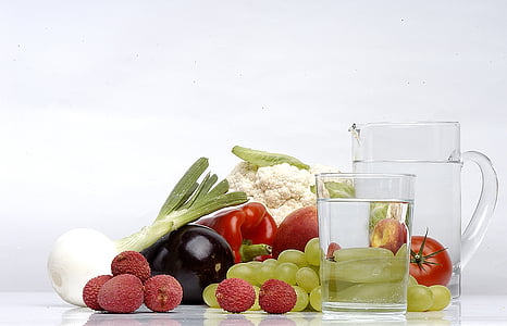 assorted fruit and vegetable beside clear glass pitcher thumbnail
