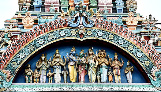 Hindu deity statues on building taken during daytime thumbnail