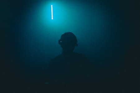 man in a dark room thumbnail