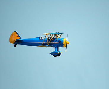 closeup photo of blue and yellow plane thumbnail