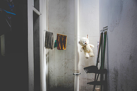 white bear plush toy hanged on clothes net thumbnail