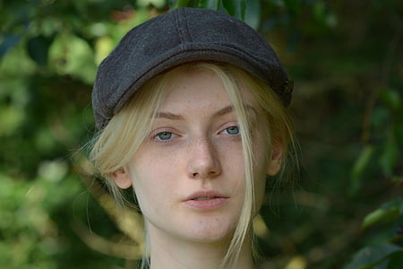 woman with black flat cap posing for photo thumbnail