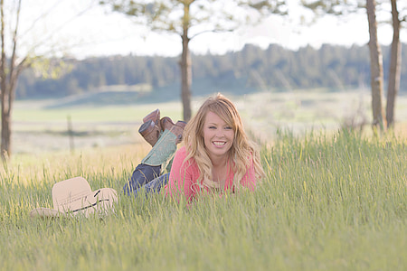 photography of woman proning on grass thumbnail