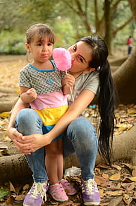 woman and girl sitting on trunk thumbnail