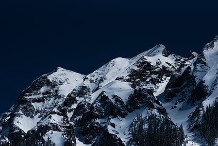 rock formation covered with snow landscape photograph thumbnail
