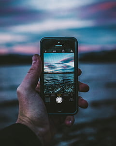 person taking photo of water thumbnail