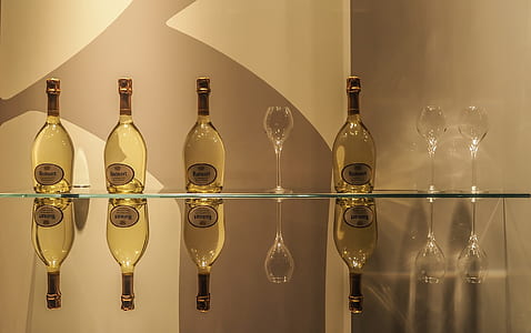 four clear glass bottles on panel thumbnail