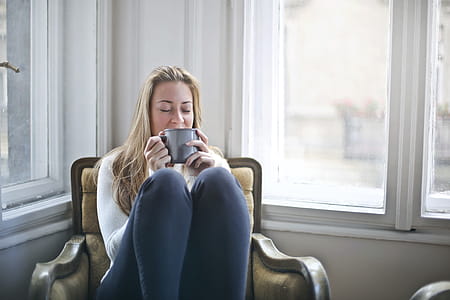 Woman Holding Gray Ceramic Mug thumbnail