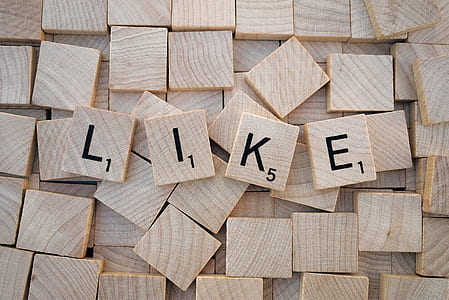 wooden scrabble tiles forming like word thumbnail