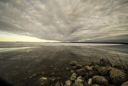 Lakeshore Landscape under Cloudy Dramatic Skies at dusk on Great Slave Lake thumbnail