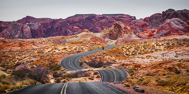 asphalt road between desert thumbnail