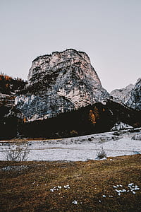 landscape photography of snowy mountain and trees thumbnail
