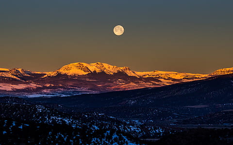 mountain near forest with lunar phase thumbnail