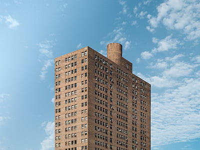 brown concrete building at daytime thumbnail
