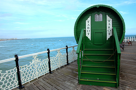 green wooden tarot cottage on wooden footbridge thumbnail