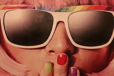 close view of person wearing white, red, and white striped sunglasses covering mouth thumbnail