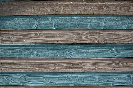 Close-up shot of blue and cream-coloured wood panels. Image captured in Kent, England thumbnail