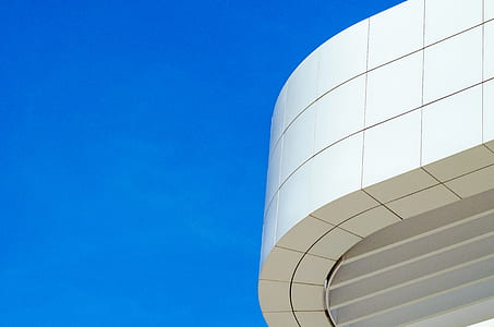 low angle photography of white concrete building at daytime thumbnail