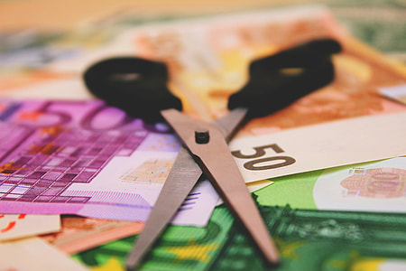 Cash bank notes and scissors thumbnail